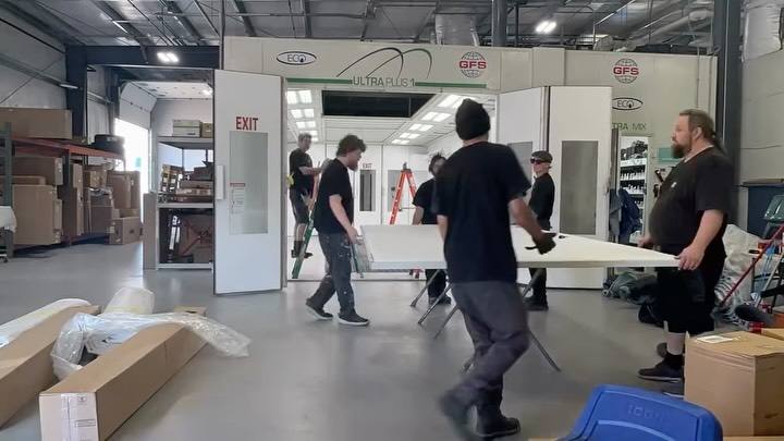 Elite crew installing a new booth inside a shop