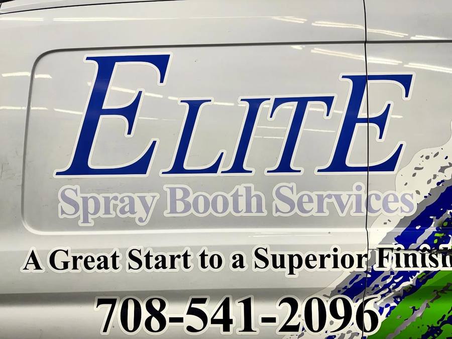 Elite lettering and phone number on a van